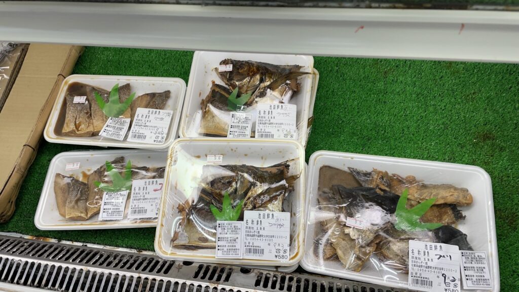 Packaged simmered fish sold at Yoshida Manzoku-kan local market