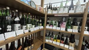 Shelves filled with bottles of Japanese sake at Ito Sake Shop