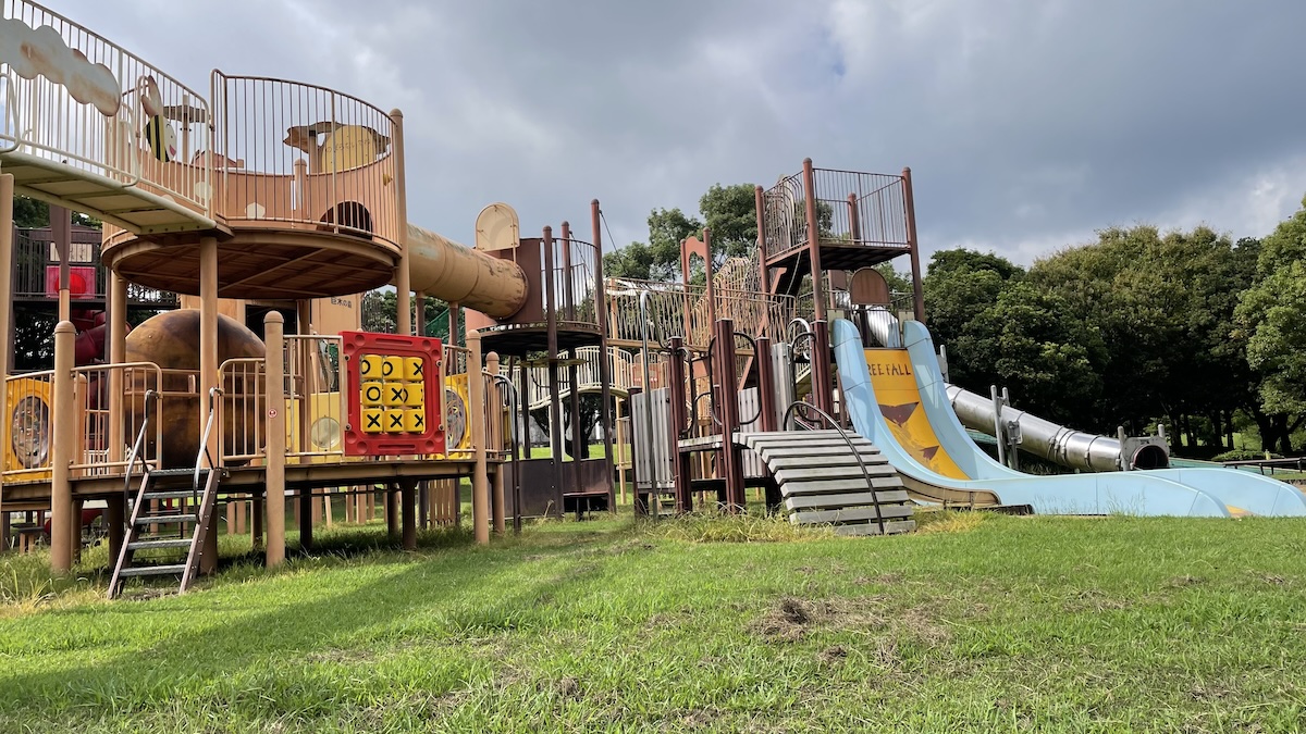 Large adventure playground with giant slides and tunnels at Hyakkadai Park