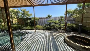 Outdoor hot spring bath with garden view at Hotel Seaside Shimabara