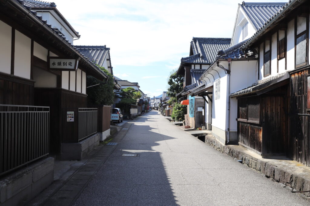 Traditional Japanese street in Kashima, Saga, with wooden houses and tiled roofs, free of overhead power lines.